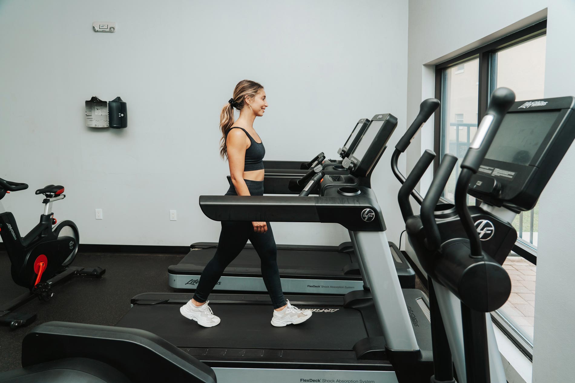 alafaya woods woman works out in fitness center