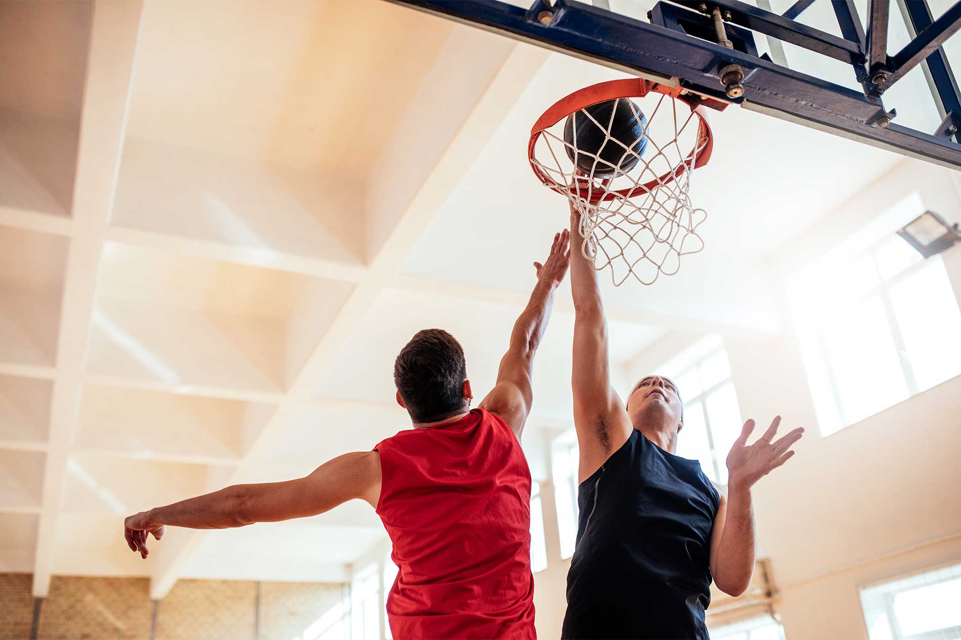 Men playing basketball