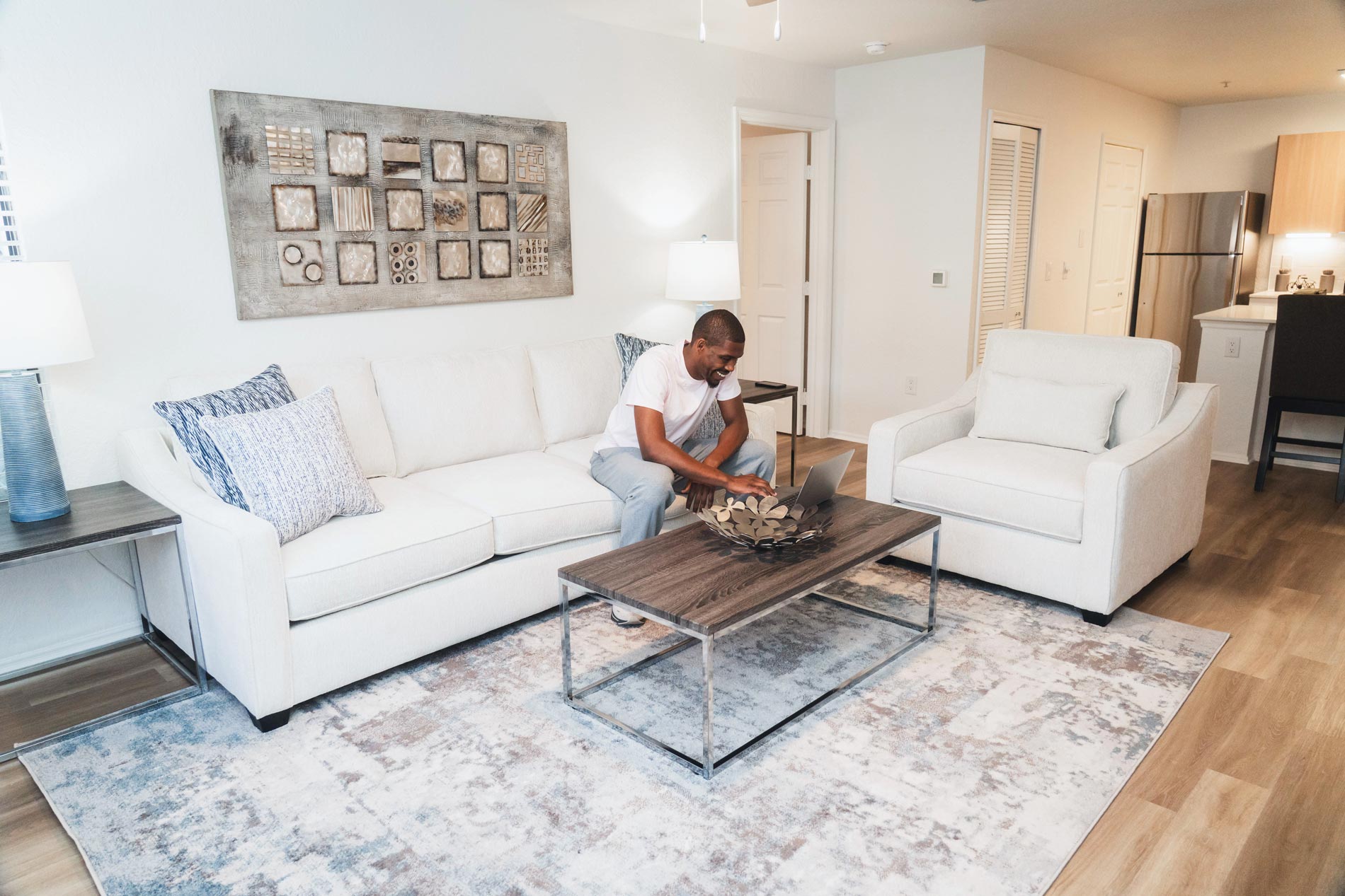 MacAlpine Place man works in living room