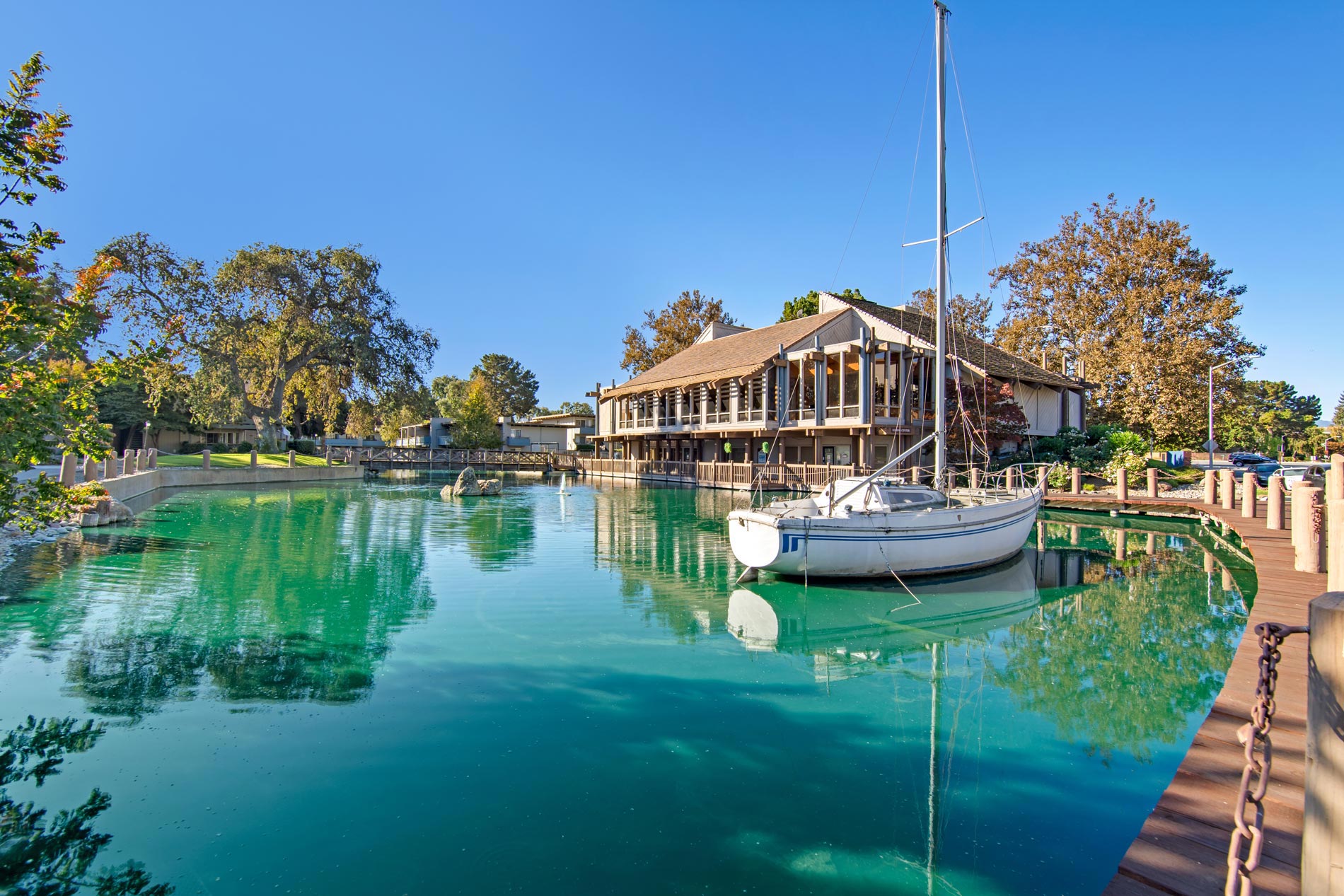 Marina Playa building exterior and pond