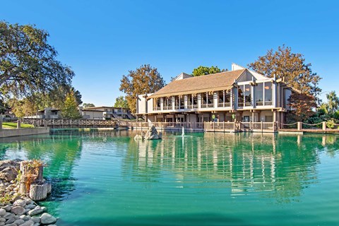 Marina Playa building exterior and pond