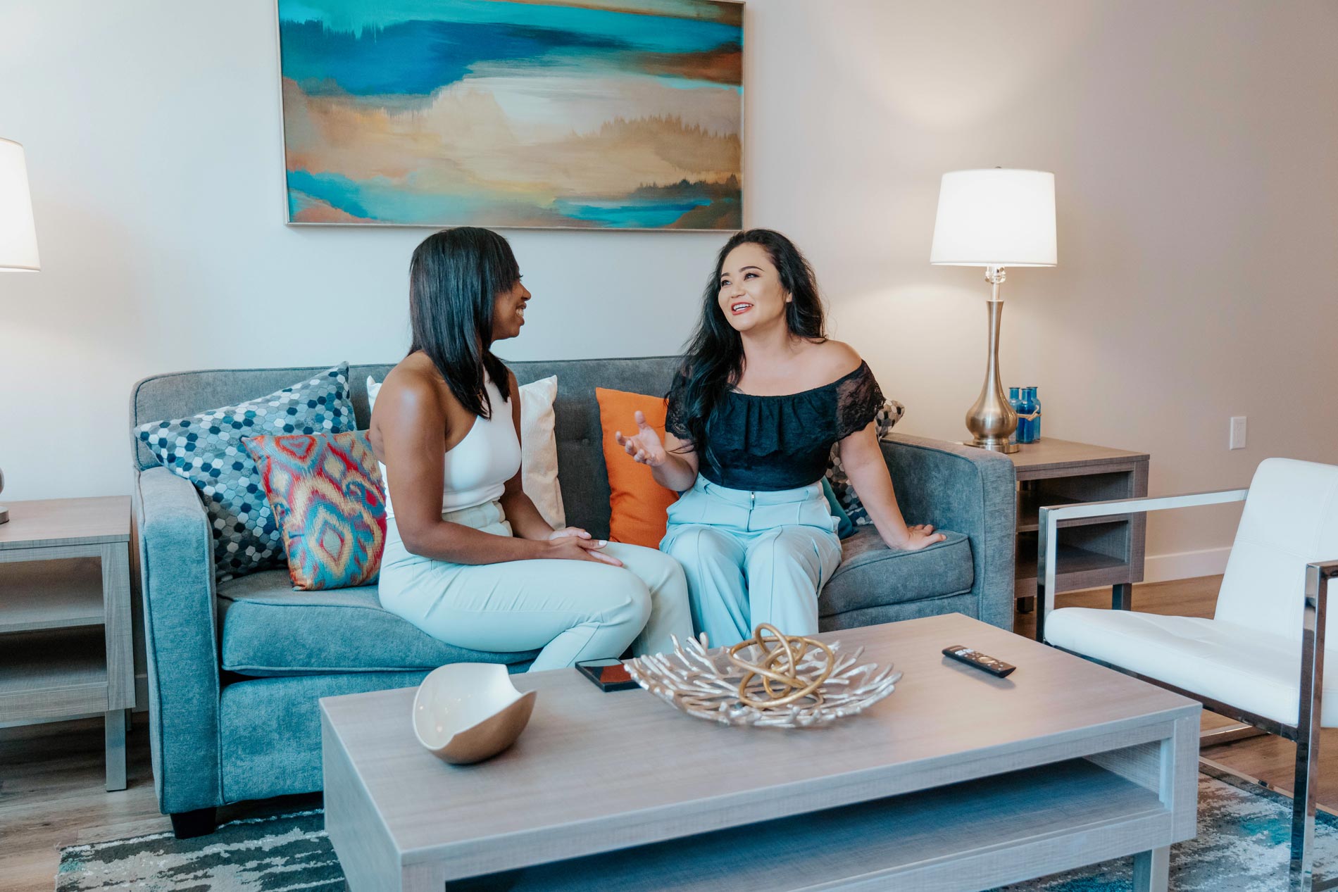 Lake Merritt two women talk in living room