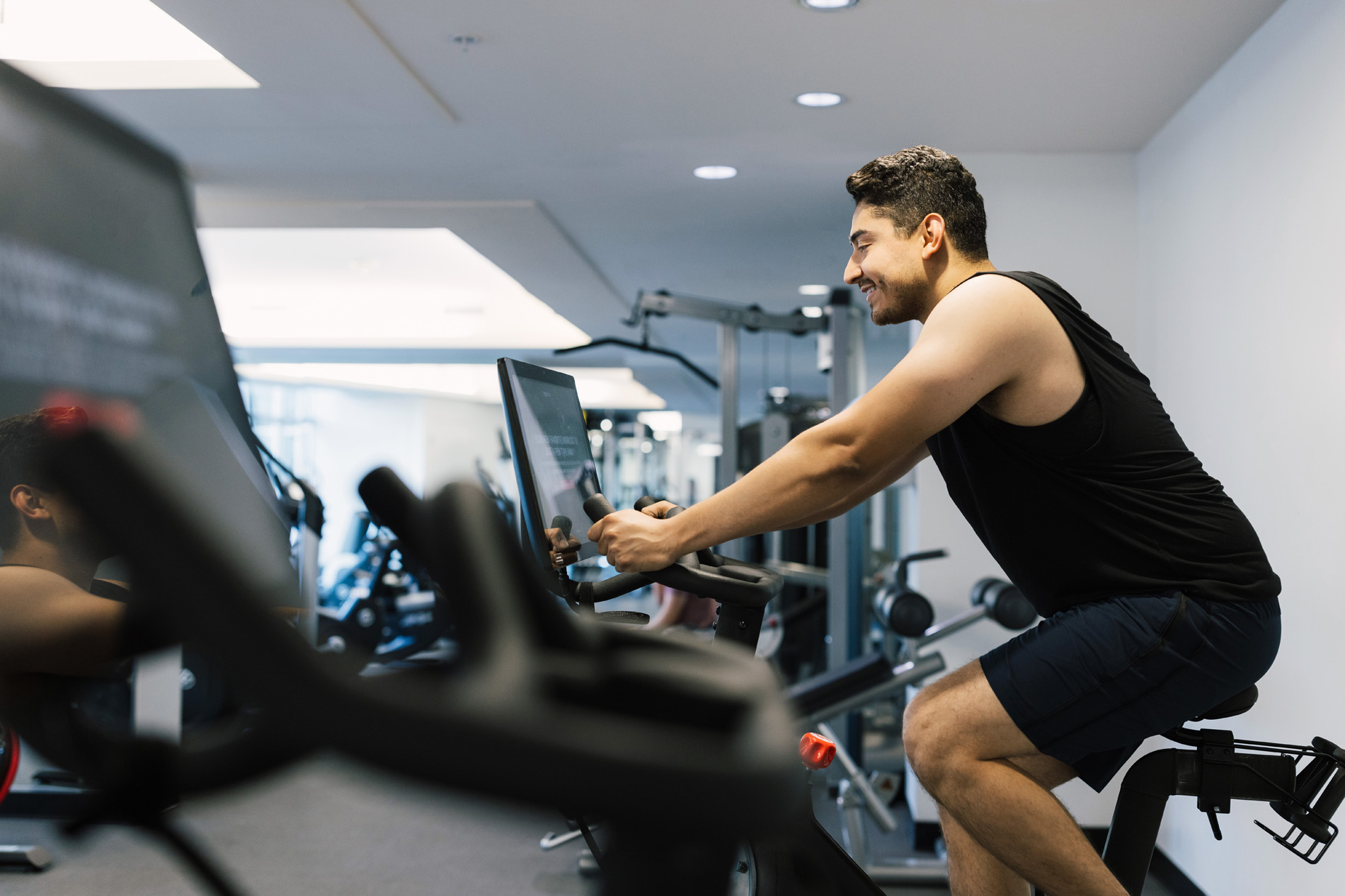 View 14 man rides stationary bike 