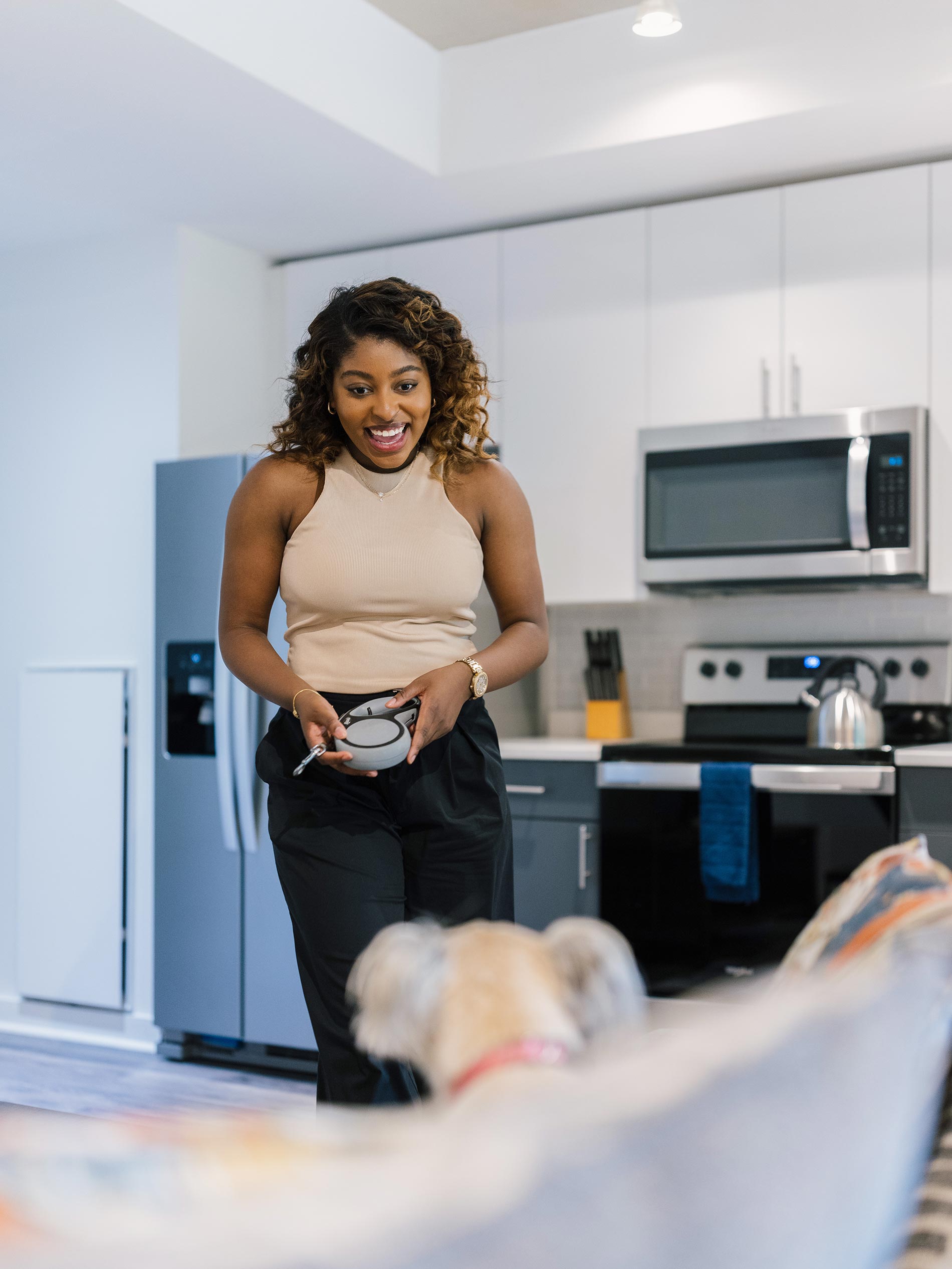 View 14 woman in staged kitchen